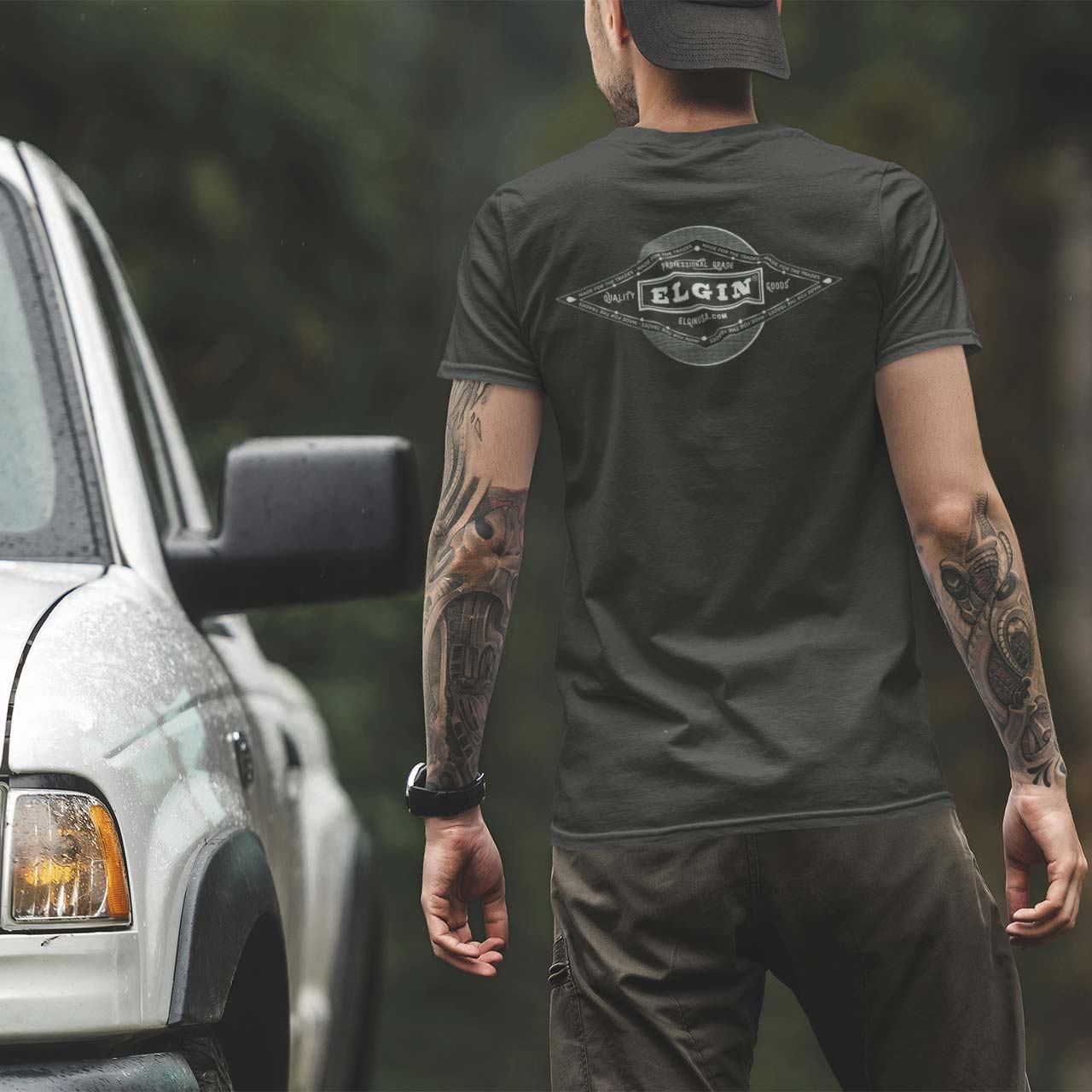Man with tattoos wearing Elgin Vintage Logo T-shirt Elgin® USA